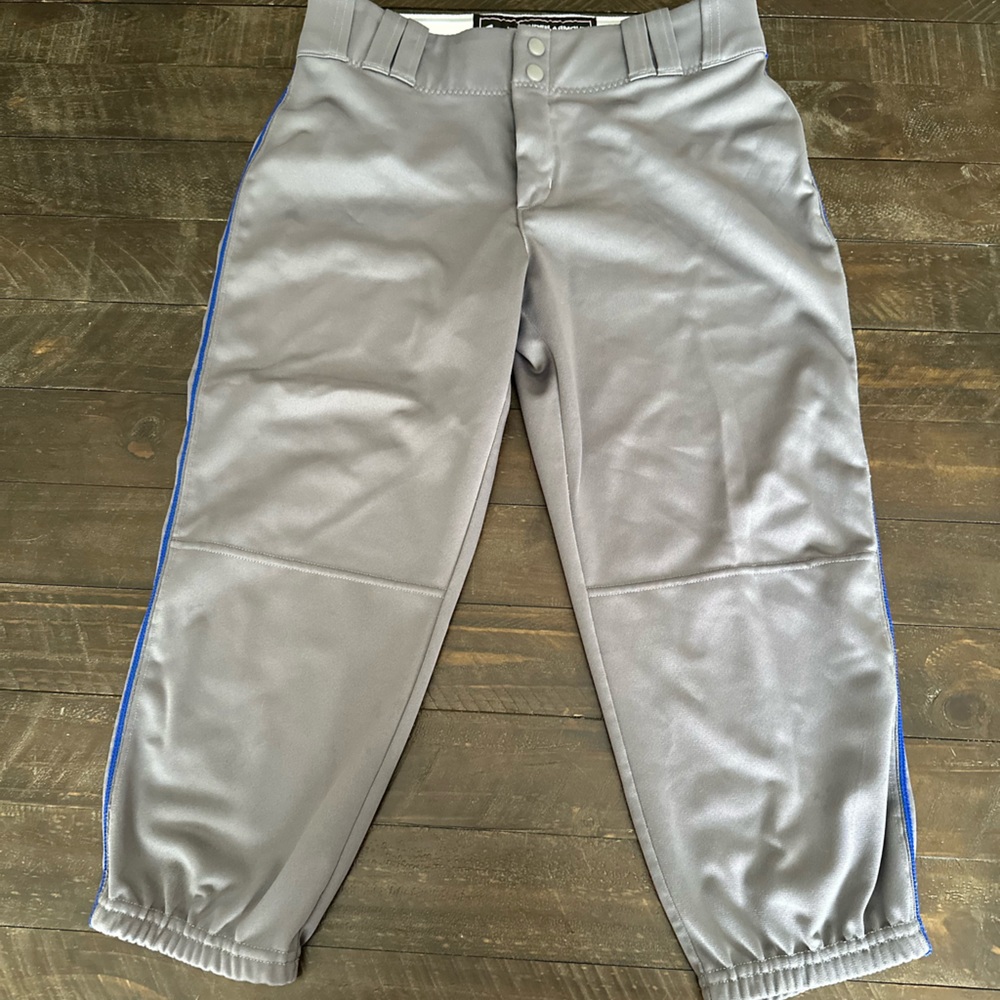 Under Armour Women’s softball pants, grey with royal leg stripe, size M